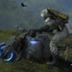 An image from Death Stranding depicting protagonist Sam Bridges riding a motorbike on mountainous terrain.